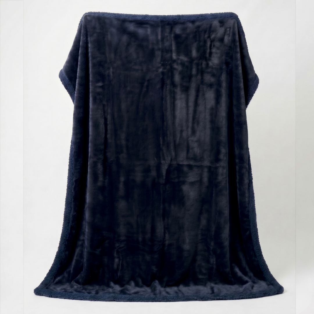 Midnight charcoal blue Minky Sherpa fleece sex blanket draped over a white background, displaying its luxurious plush finish and cosy warmth.