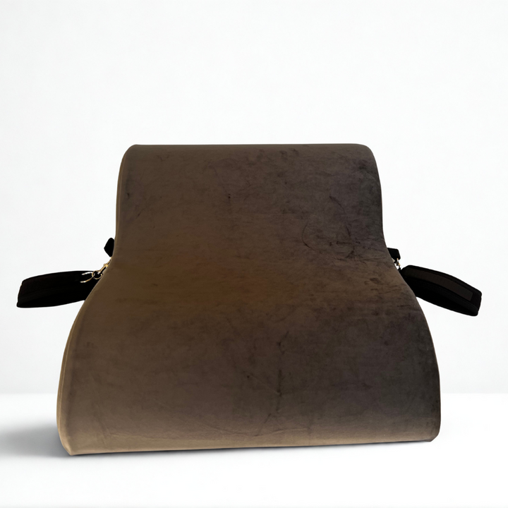 Bumpy Cuddles pillow with attached black wrist restraints for enhanced comfort, positioning, and intimate play.