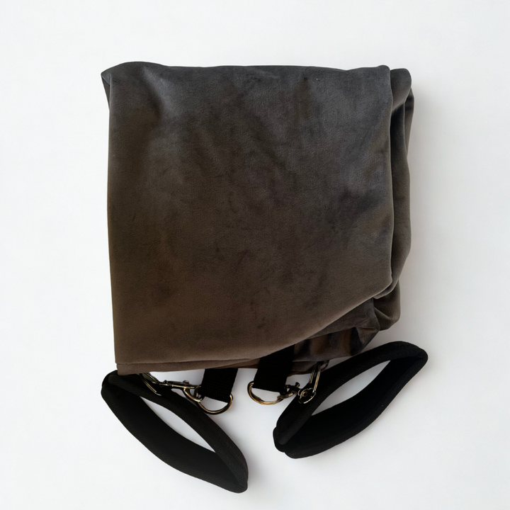 Folded Bumpy Cuddles  pillow restraint cover with attached black wrist restraints for secure and comfortable intimate positioning.